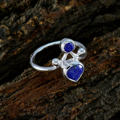 Scarlett blue dual stone ring sterling silver band with round and pear shaped blue stones on bark