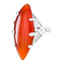 Traditional red solitaire ring by Siti featuring a marquise-shaped red stone with silver prong setting