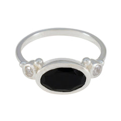 Natalie sterling silver ring with oval black stone and two small clear side stones trendy black trilogy ring
