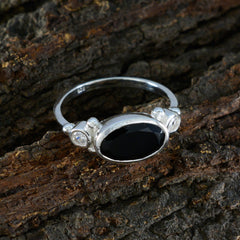 Silver Natalie trendy black trilogy ring with oval black center stone and two small side crystals on bark