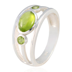 Putri trendy green gemstone ring with three oval green stones set in a silver band