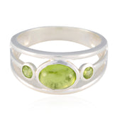 Putri trendy green gemstone ring with three oval green stones set in silver band