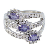 Trendy multicolor trilogy ring with three purple gemstones and surrounding clear crystals in silver band