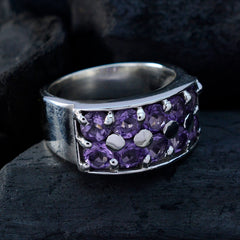 Ivana trendy purple gemstone ring with multiple round purple stones set in a wide silver band