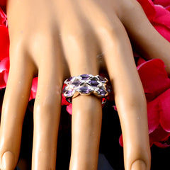 Kristine trendy purple gemstone ring on mannequin hand with woven silver band set with amethyst stones for evening wear