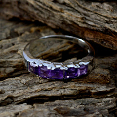 Dayana trendy purple gemstone ring with five square amethyst stones set in polished silver band on wood