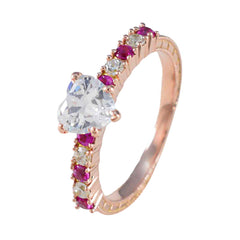 Yasmin rose gold ring with heart shaped clear center stone and pave red and clear gems trendy red gemstone ring