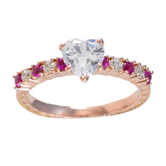 Yasmin trendy red gemstone ring rose gold band with heart shaped clear center stone and alternating ruby and diamond accents