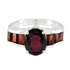 Andrea trendy red gemstone ring with oval center stone and rectangular side stones in silver band