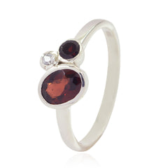Yan trendy red gemstone ring featuring two red gemstones and one clear gemstone on silver band