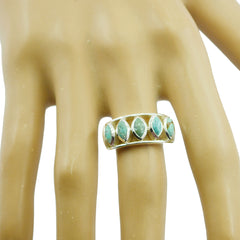 Mila trendy turquoise gemstone ring gold band with five marquise turquoise stones on a hand