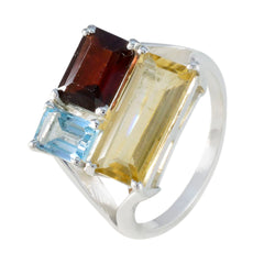 Lucy trilogy multicolor gemstone ring with emerald cut red garnet, yellow citrine, and blue topaz set in sterling silver