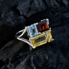 Lucy trilogy multicolor gemstone ring with emerald cut yellow citrine blue topaz and garnet on silver band