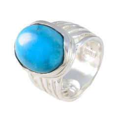 Ellie turquoise solitaire ring with a large oval turquoise stone set in a polished silver band