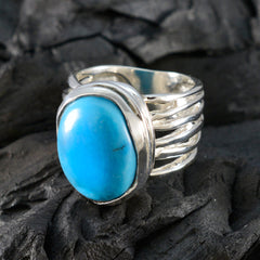 Ellie turquoise solitaire ring with large oval stone set in a silver multi-band setting