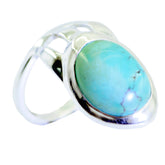 Violet turquoise solitaire ring with oval blue-green stone set in a polished silver band