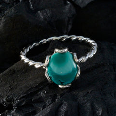 Freya turquoise solitaire ring with twisted silver band and polished turquoise stone