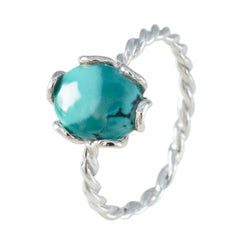 Freya turquoise solitaire ring with twisted silver band and polished round turquoise stone