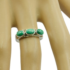 Haruka turquoise trilogy ring with three oval turquoise stones set in silver band on finger