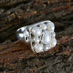 Victorian Navratna ring with pearl gemstones set in silver by Katarina on rustic wood