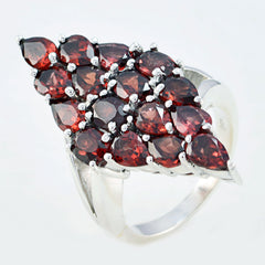 Violet antique gemstone ring with multiple deep red gemstones set in silver band