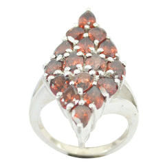 Violet antique gemstone ring featuring multiple deep red gemstones set in silver band