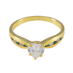 Violet green gemstone wedding ring with gold band and heart-shaped clear center stone