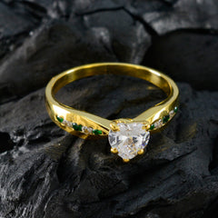 Violet green gemstone wedding ring with gold band and heart-shaped center diamond