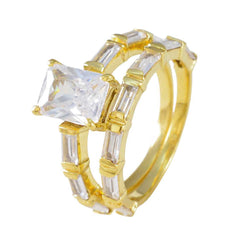 Cecilia gold plated white crystal wedding ring set with emerald cut center stone and baguette accents