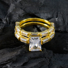 Cecilia gold bands white crystal wedding ring set with large emerald cut center stone and baguette accents