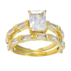 Cecilia gold bridal band and engagement ring with emerald cut center and baguette stones white crystal wedding ring set