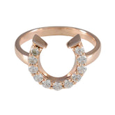 Micaela white gemstone statement ring with rose gold band and sparkling stones in horseshoe shape