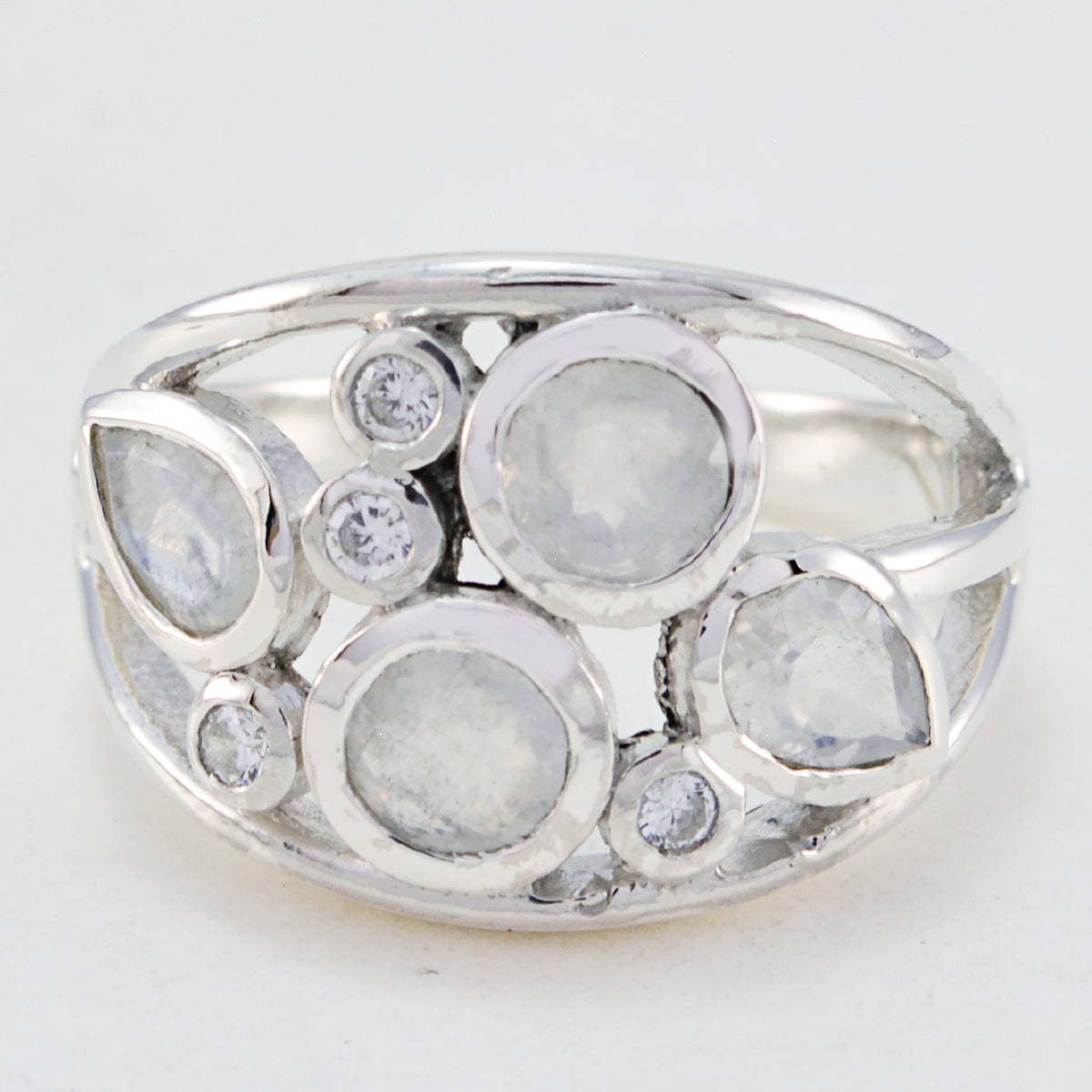 Julia white gemstone statement ring in sterling silver featuring multiple round and pear shaped white stones