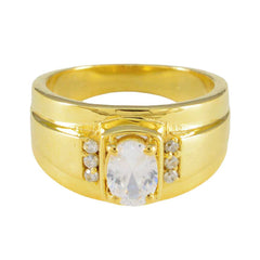 Nisa gold ring with a large central white stone and smaller side stones white halo engagement ring