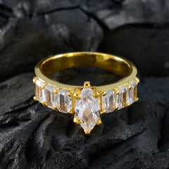 Victoria white hepta engagement ring with gold band and clear marquise center stone
