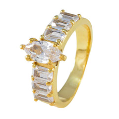 Victoria gold ring featuring a white hepta engagement ring design with multiple clear stones