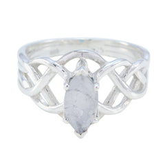 Charlotte white solitaire art deco ring featuring a marquise stone with intricate silver band design