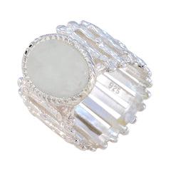 Clara white solitaire band ring with textured silver design and smooth round centerpiece