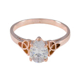 Yasmine rose gold white solitaire ring for women with a pear-shaped clear stone and unique side accents