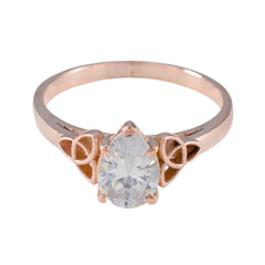 Yasmine rose gold white solitaire ring for women with a pear-shaped clear stone and unique side accents