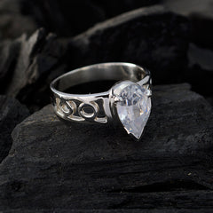 Skylar white solitaire ring with pear-shaped clear gemstone and intricate silver band design