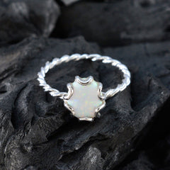 Evelyn white solitaire ring with opal center set in claw prongs on twisted sterling silver band dainty engagement style