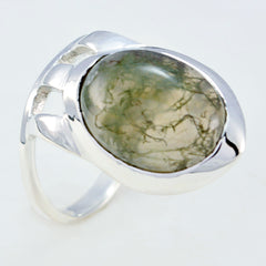 Andrea white solitaire signet ring with smooth silver band and oval green stone centerpiece