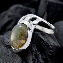 Andrea white solitaire signet ring with oval green gemstone set in polished silver band