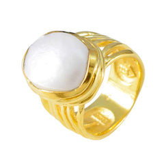 Eleanor white solitaire statement ring with a large white stone set in a gold band