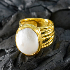 Eleanor gold ring featuring a white solitaire statement ring design with a large pearl centerpiece