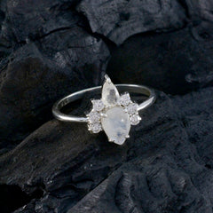 Natcha white toi et moi ring with pear-shaped moonstones and surrounding small diamonds on silver band