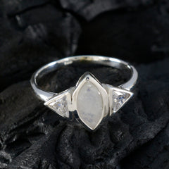 Lucy white trilogy ring featuring a marquise center stone and two triangular side stones in silver band