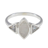 Lucy white trilogy ring featuring a marquise center stone with two triangular side stones in silver band
