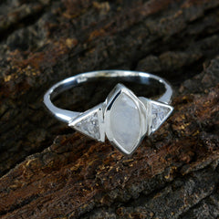 Lucy white trilogy ring featuring a marquise center stone and two triangular side stones on silver band